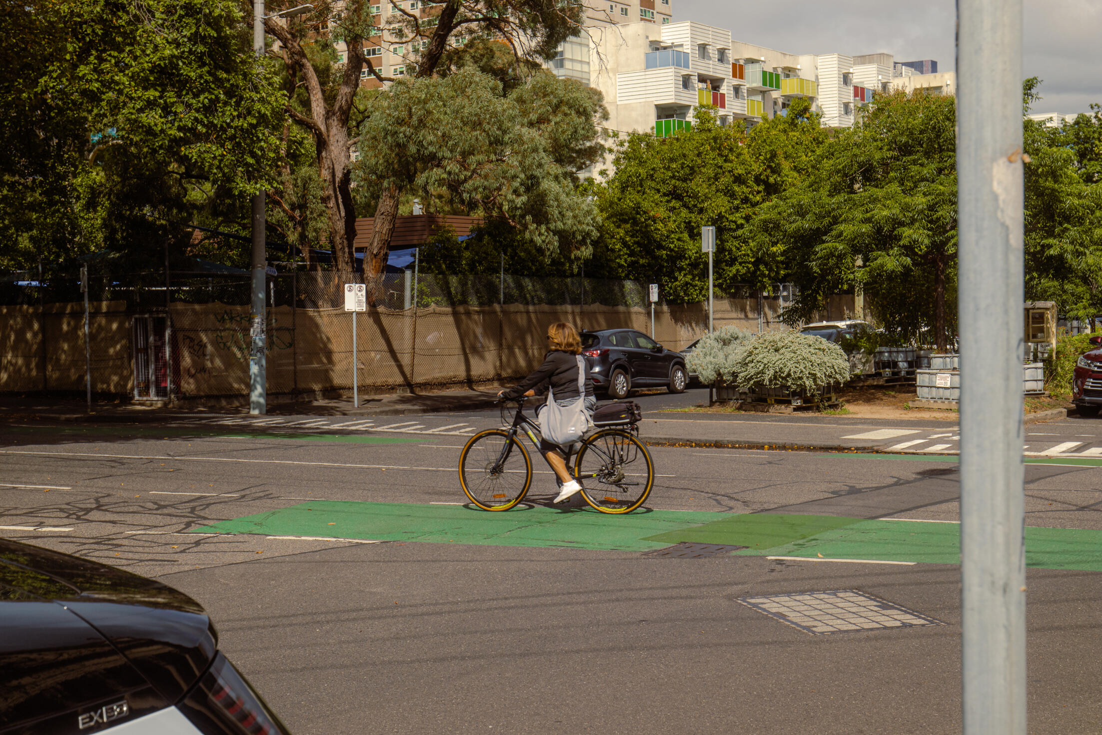 Woman riding bicycle on an empty road