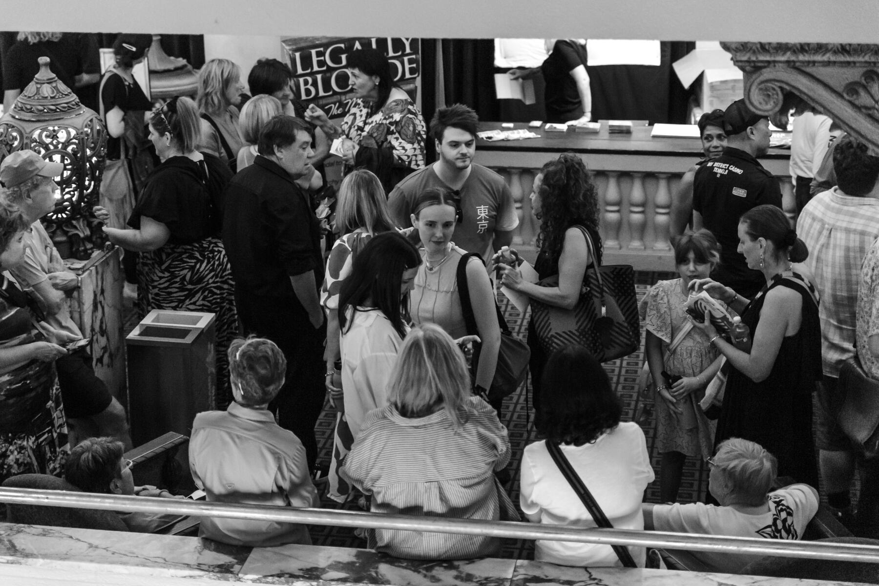 A crowd in the foyer of a theatre