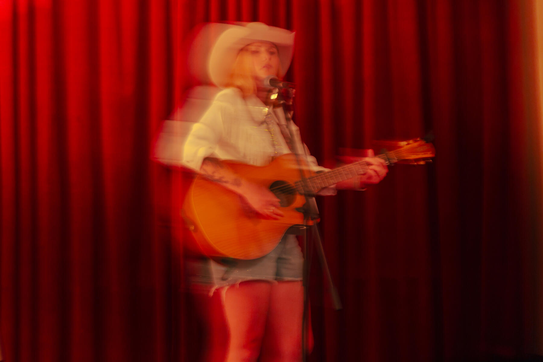 Female country singer performing in a theatre