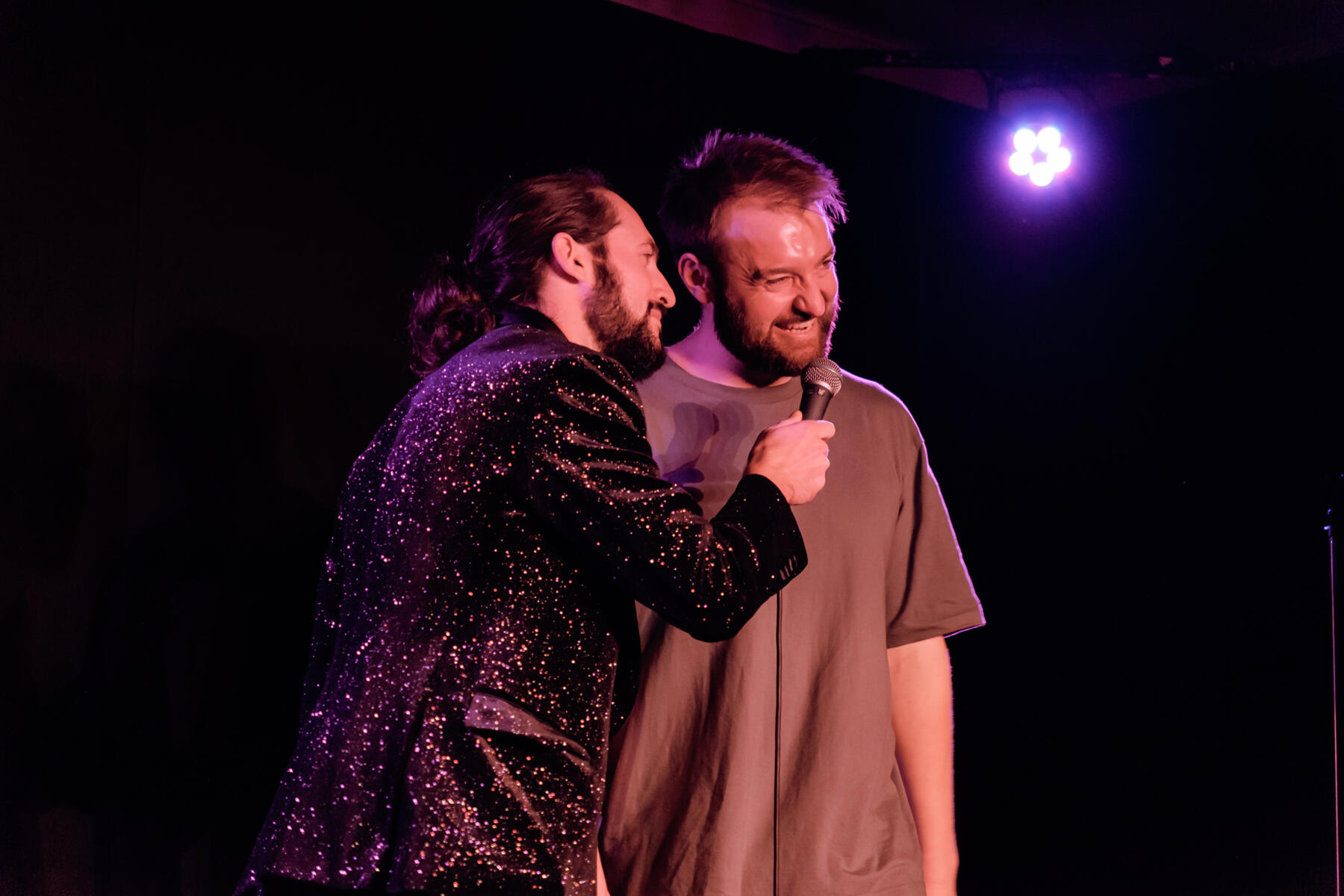 A man interviewing another man for a comedy sketch