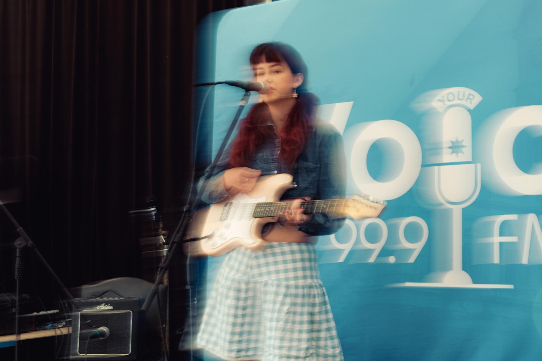 Female alternative singer performing at a fundraising event